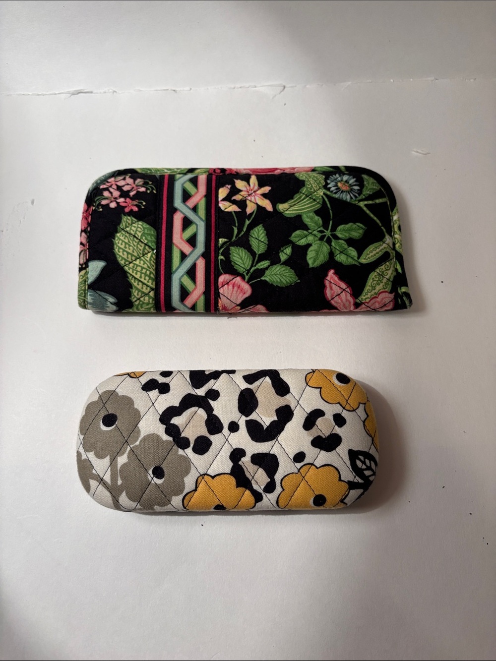 Vera Bradley Floral hard eyeglass case and floral soft eyeglass case.
